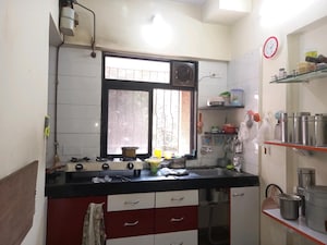 Kitchen in 2 BHK Apartment at Yashraj Park CHS, Kasarvadavali – for Rent