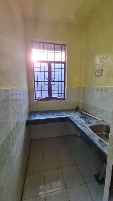 Kitchen in 1.5 BHK Apartment at Sector 10 Greater Noida – for Rent