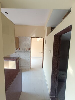 Kitchen in 1 BHK Apartment at Shree Ostwal Orchid Building No 9 to 12, Mira Road – for Sale