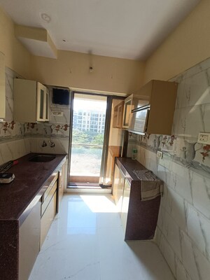 Kitchen in 1 BHK Apartment at Shree Ostwal Orchid Building No 9 to 12, Mira Road – for Sale