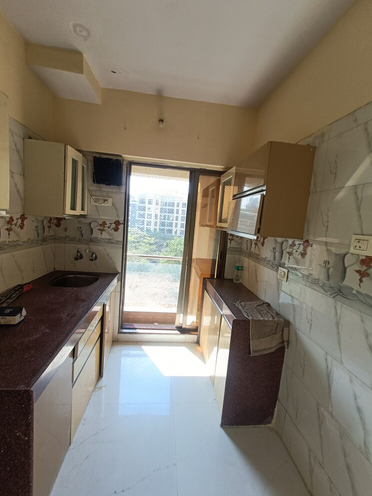 Kitchen, shree-ostwal-orchid-building-no-9-to-12 1 Bedroom 695 Sq.Ft. Apartment In Mira Road Thane 9642919