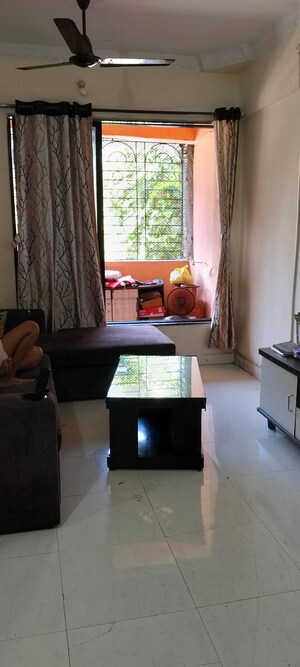Living Room in 1 BHK Apartment at Seawoods Sector 50 – for Rent