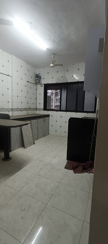 Kitchen in 3 BHK Apartment at Siddharth Nagar CHS, Borivali East – for Rent