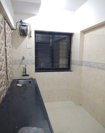 Kitchen in 1 BHK Apartment at K Raheja Palm Court, Malad West – for Sale