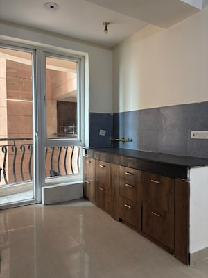 Kitchen in 2 BHK Apartment at Sikka Karmic Greens, Sector 78 – for Rent