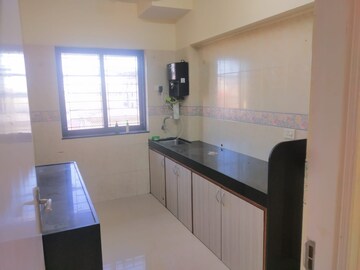 Kitchen in 2 BHK Apartment at K Raheja Palm Spring, Malad West – for Rent