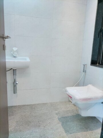 Bathroom in 2 BHK Apartment at Lalani Velentine Apartment 1 Wing D, Malad East – for Rent