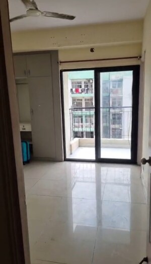 Room in 2 BHK Apartment at Charms Castle, Raj Nagar Extension – for Rent