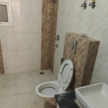 Bathroom in 3 BHK Apartment at Niho Saffron Scottish Garden, Ahinsa Khand 2 – for Rent