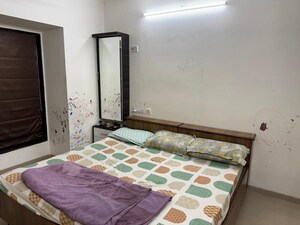 Bedroom in 2 BHK Apartment at Lokhandwala Whispering Palms, Kandivali East – for Rent