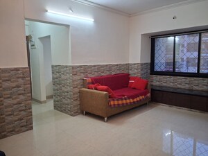 Living Room in 1 BHK Apartment at Satellite Garden, Goregaon East – for Sale