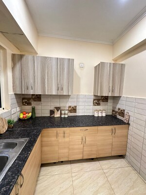 Kitchen in 3 BHK Apartment at Prateek Wisteria, Sector 77 – for Rent