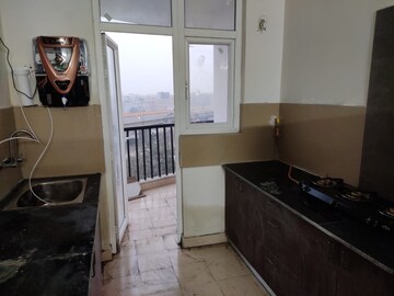 Kitchen in 3 BHK Apartment at Amrapali Heartbeat City, Sector 107 – for Rent