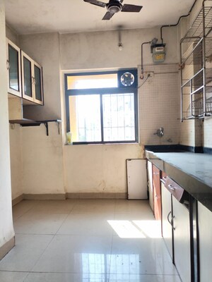 Kitchen in 1 BHK Apartment at New Brahmand Phase 7 CHS, Brahmand – for Sale