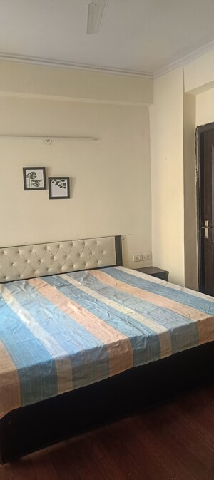 Bedroom in 2 BHK Apartment at Aims Golf City, Sector 75 – for Rent