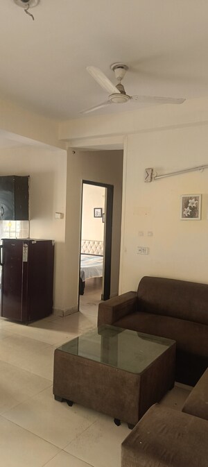 Living Room in 2 BHK Apartment at Aims Golf City, Sector 75 – for Rent