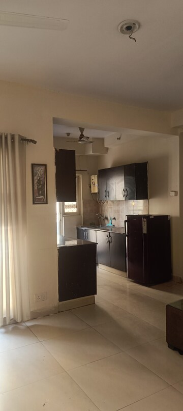 Kitchen in 2 BHK Apartment at Aims Golf City, Sector 75 – for Rent