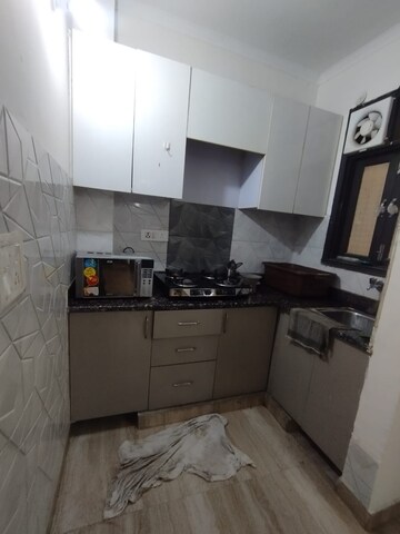Kitchen in 2 BHK Builder Floor at Freedom Fighters Enclave – for Rent