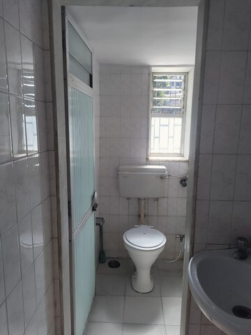 Bathroom in 1 BHK Apartment at Nutan Gangotri CHS, Andheri West – for Rent