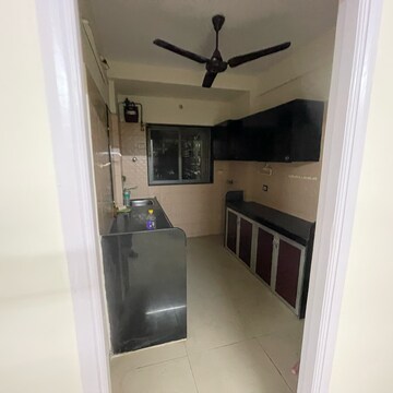 Kitchen in 2 BHK Apartment at Sameer Apartments, Yari Road – for Rent