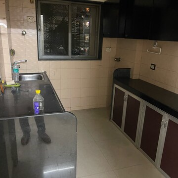 Kitchen in 2 BHK Apartment at Sameer Apartments, Yari Road – for Rent