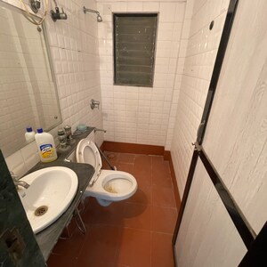 Bathroom in 2 BHK Apartment at Sameer Apartments, Yari Road – for Rent
