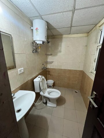 Bathroom in 2 BHK Apartment at Aims Golf City, Sector 75 – for Rent