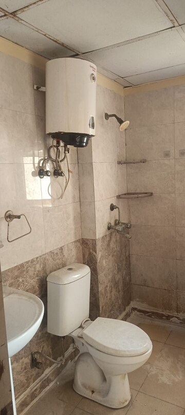 Bathroom in 3 BHK Apartment at Aims Golf City, Sector 75 – for Rent