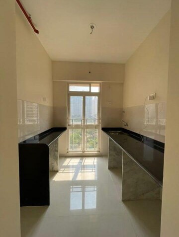 Kitchen in 1.5 BHK Apartment at Vijay Orovia, Ghodbunder Road – for Sale