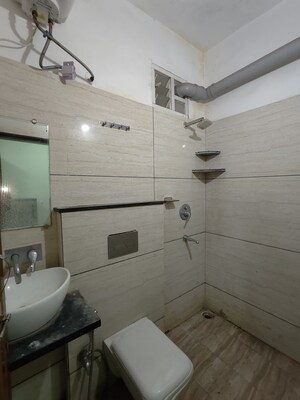 Bathroom in 1 BHK Apartment at Satguru Heights, Gulmohar Colony – for Rent