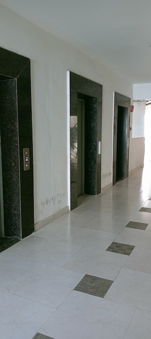 Building Lobby in 2 BHK Apartment at Sushant Golf City – for Rent