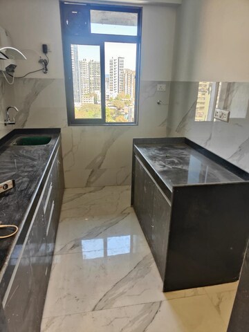 Kitchen in 2 BHK Apartment at Dev Leo Tower, Oshiwara – for Rent