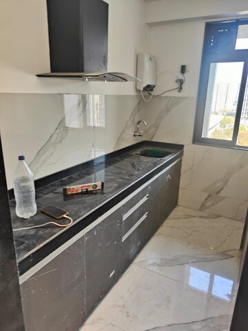 Kitchen in 2 BHK Apartment at Dev Leo Tower, Oshiwara – for Rent