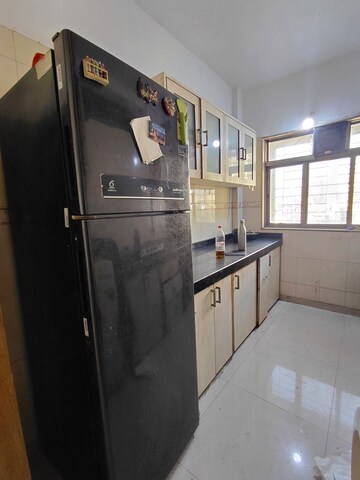 Kitchen in 2 BHK Apartment at Ashok Enclave Malad West, Malad West – for Rent