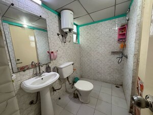 Bathroom in 3 BHK Apartment at Gaur City 6th Avenue, Sector 4 Greater Noida – for Rent