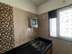 Kitchen in 2 BHK Apartment at G K Roseland Residency, Pimple Saudagar – for Rent