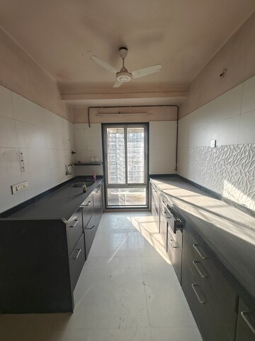 Kitchen in 3 BHK Apartment at Rattan Icon, Seawoods Sector 50 – for Rent