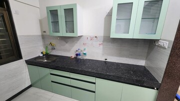 Kitchen in 2 BHK Apartment at Acme Ozone Oakwood and Ashwood, Manpada – for Rent