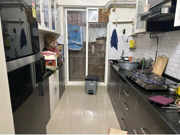 Kitchen in 1 BHK Apartment at Rosa Gardenia, Ghodbunder Road – for Sale
