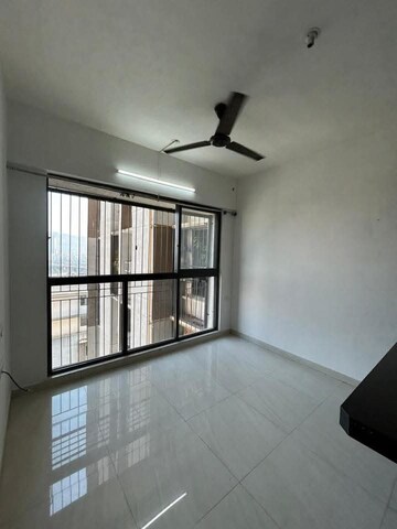 Living Room in 1 BHK Apartment at Lodha Crown Quality Homes, Majiwada – for Rent