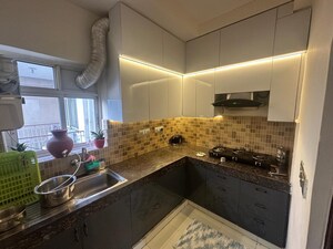 Kitchen in 2 BHK Apartment at Orris Carnation Residency, Sector 85 – for Sale