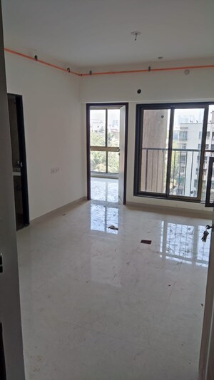 Living Room in 1 BHK Apartment at Chandak Nishchay Wing E, Borivali East – for Rent