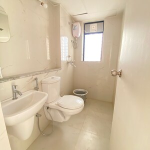 Bathroom in 1 BHK Apartment at Runwal Gardens Phase 3, Kalyan Shilphata Road – for Rent