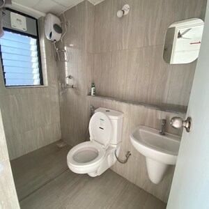 Bathroom in 1 BHK Apartment at Runwal Gardens Phase 3, Kalyan Shilphata Road – for Rent
