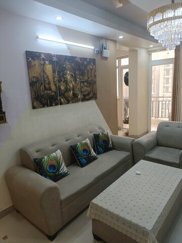 Living Room in 2.5 BHK Apartment at AIMS Golf Town, Sector 4 Greater Noida – for Sale
