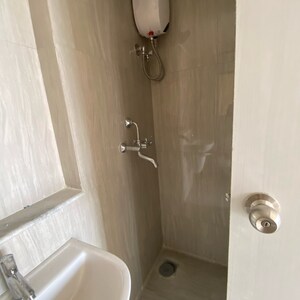 Bathroom in 1 BHK Apartment at Runwal Gardens Phase 3, Kalyan Shilphata Road – for Rent
