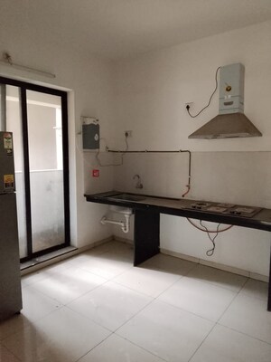 Kitchen in 2 BHK Apartment at Pride World City Kingsbury, Charholi Budruk – for Rent