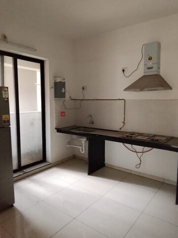 Kitchen in 2 BHK Apartment at Pride World City Kingsbury, Charholi Budruk – for Rent