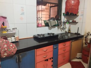 Kitchen in 1 BHK Apartment at Yashraj Park CHS, Kasarvadavali – for Sale