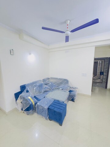 Living Room in 3.5 BHK Apartment at Aims Golf City, Sector 75 – for Rent